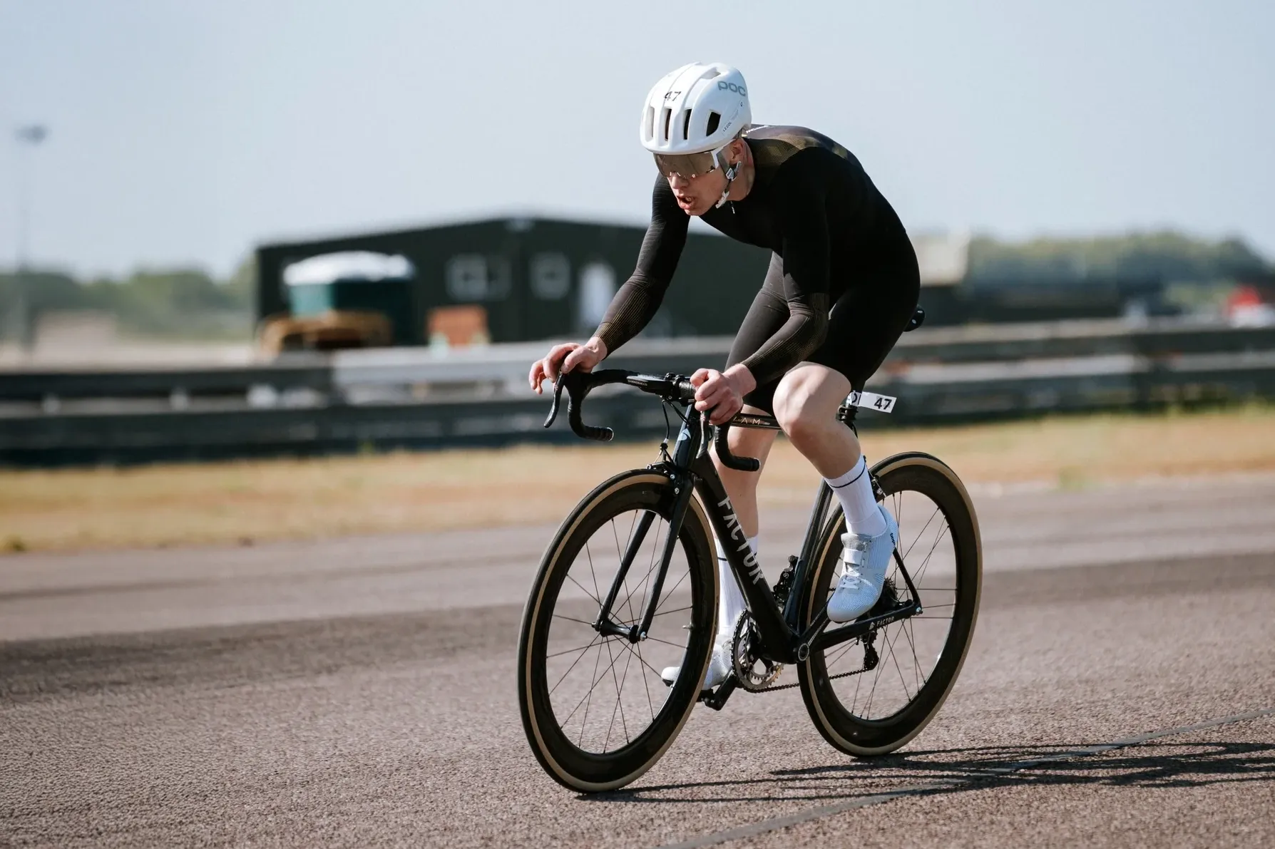 Gareth Winter road cyclist racing a time trial with a skinsuit and aerodynamic helmet